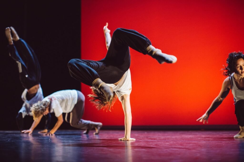 Dancer Doing A 1 handed Handstand